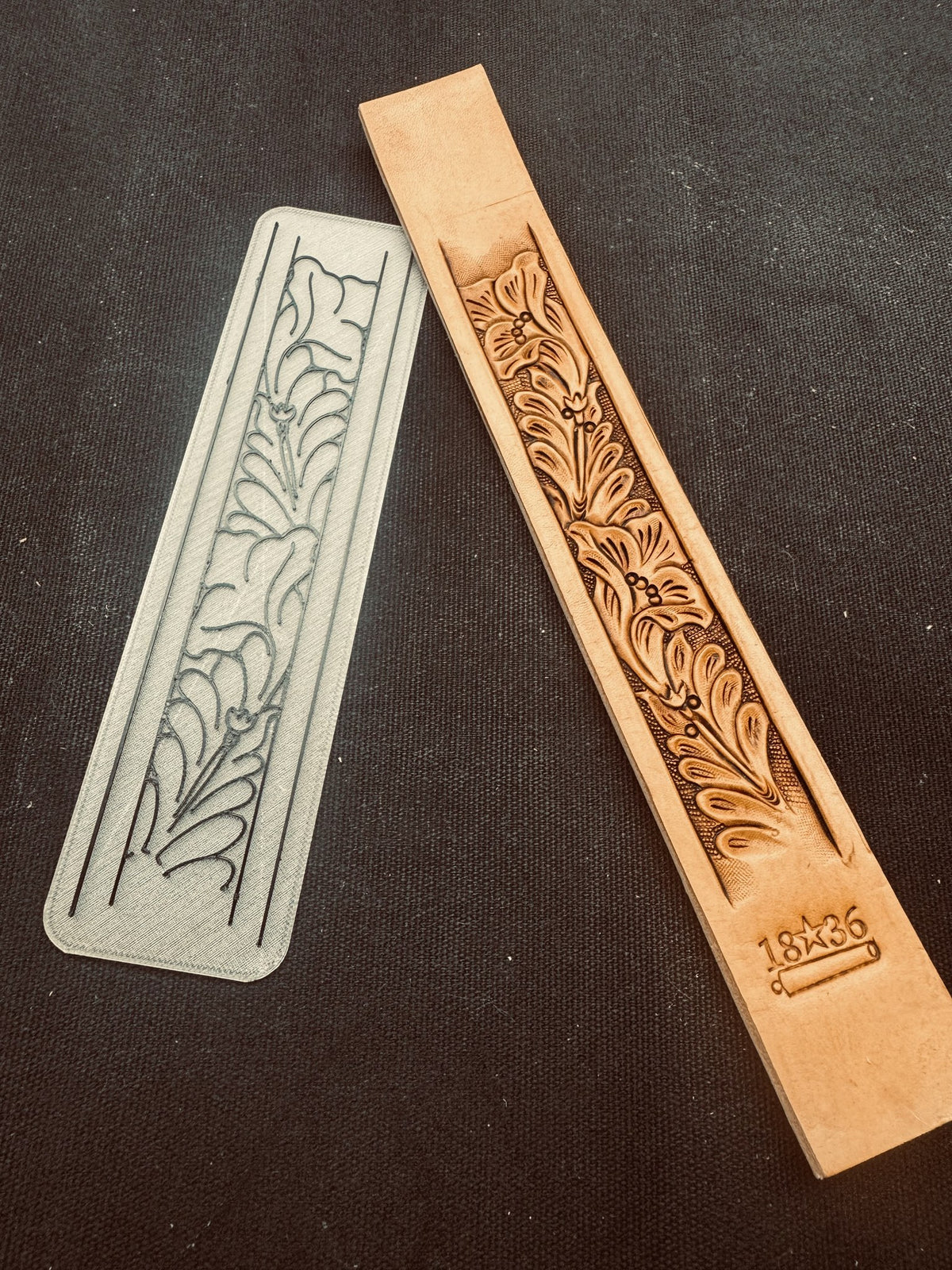 Custom 3D printed Tap-Off belt strip stamp next to the carved leather belt it produced