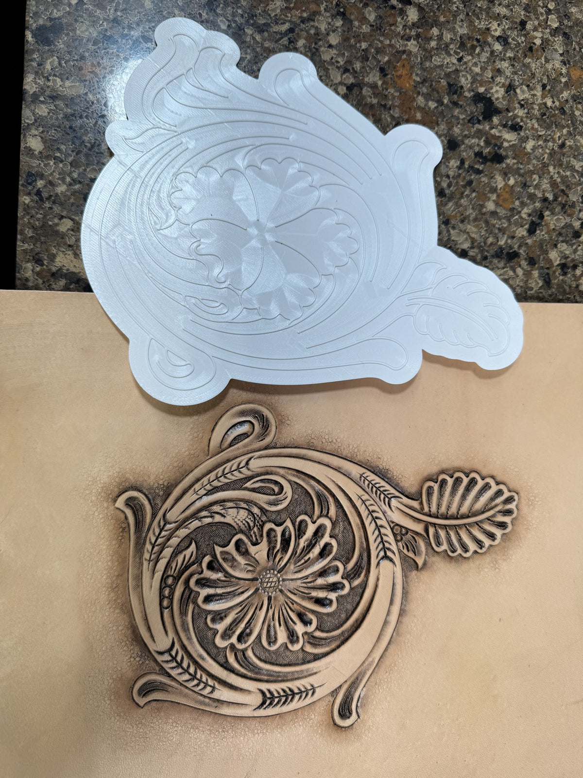 Sheridan floral corner Tap-Off stamp above the finished tooled vegetable tanned leather