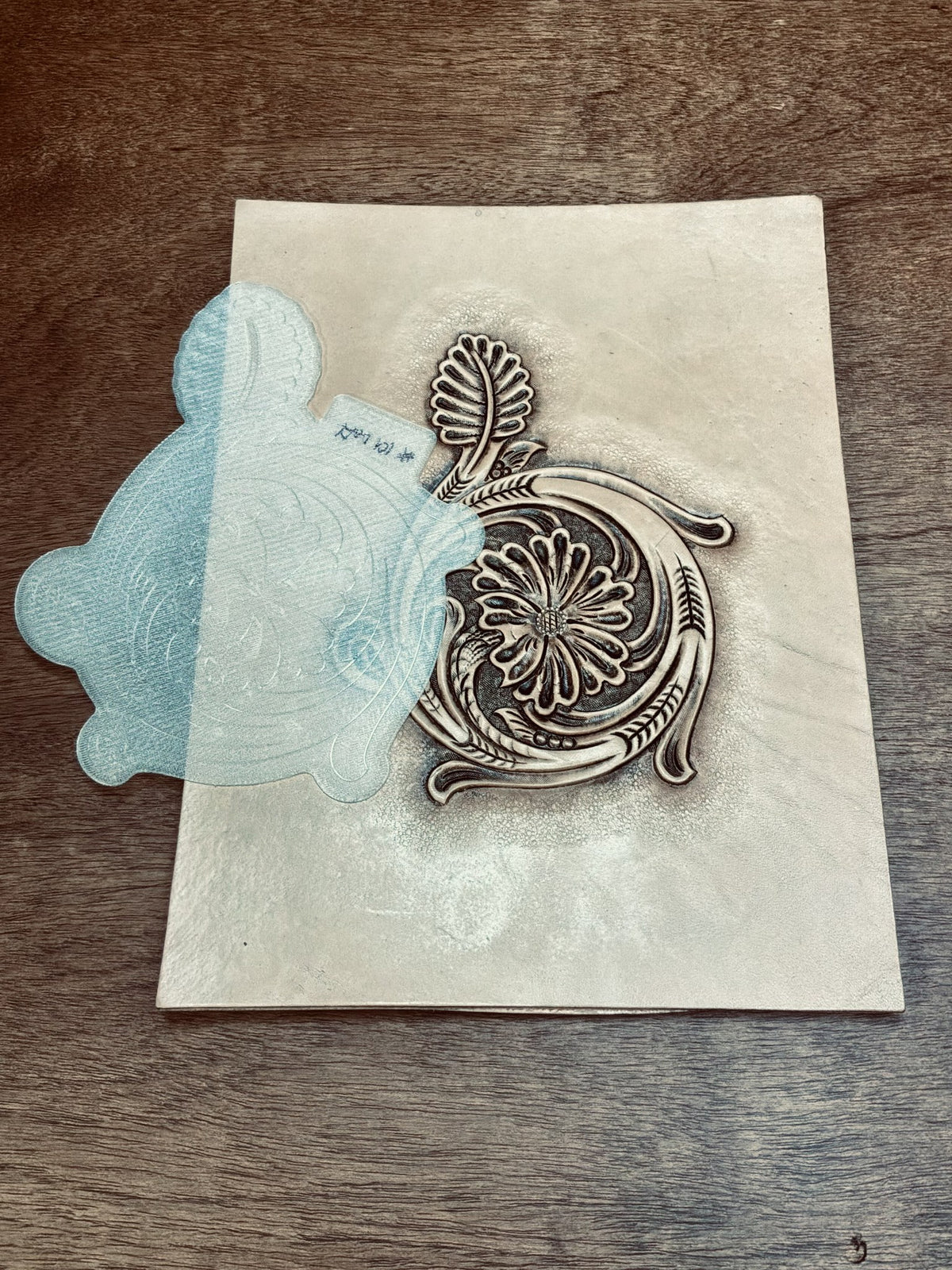 Tap-Off stamp transferring a floral tooling pattern onto damp leather