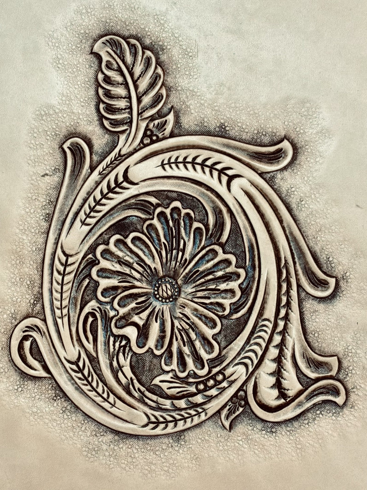 Finished Sheridan style floral leather carving made from a custom Tap-Off pattern