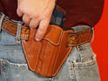 1911 5-inch left-hand OWB holster — front view, Level 1 retention
